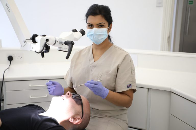 Lingual (Behind-the-Teeth) Braces Specialists doing a dental procedure for Lingual (Behind-the-Teeth) Braces Treatment completed at London Dental Specialists: A Dental Clinic in London, United Kingdom