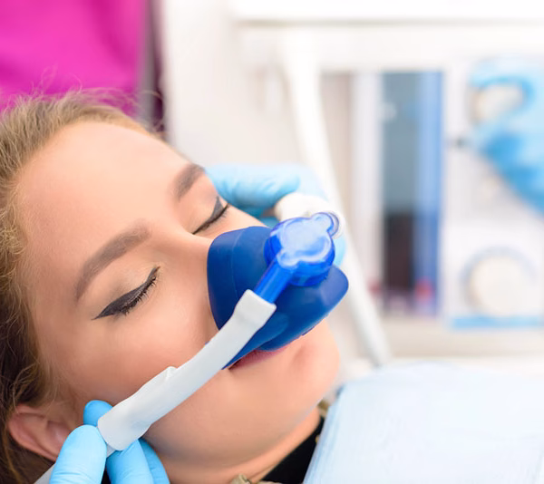 A woman getting sedation dentistry treatments at our dental clinic in London