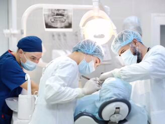 A dental surgical team treating a patient