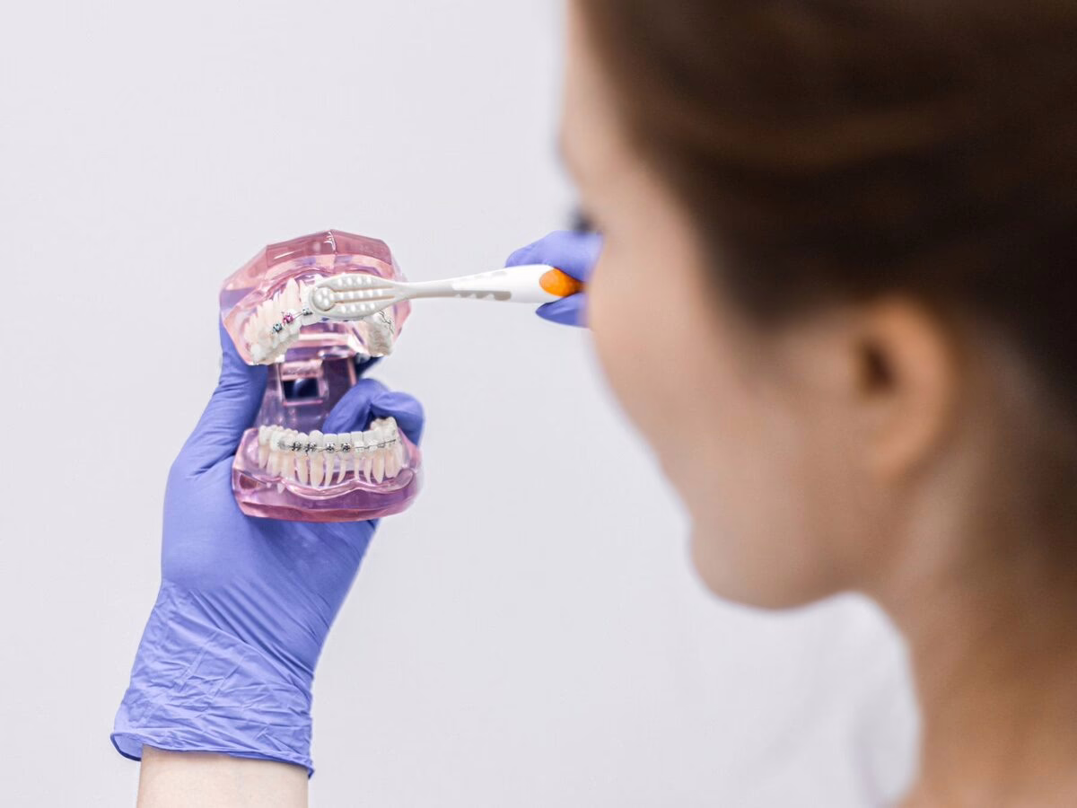 Brushing technique demonstrated on a model for a patient