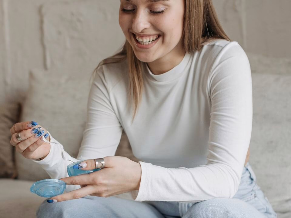 A woman at home with her aligner case