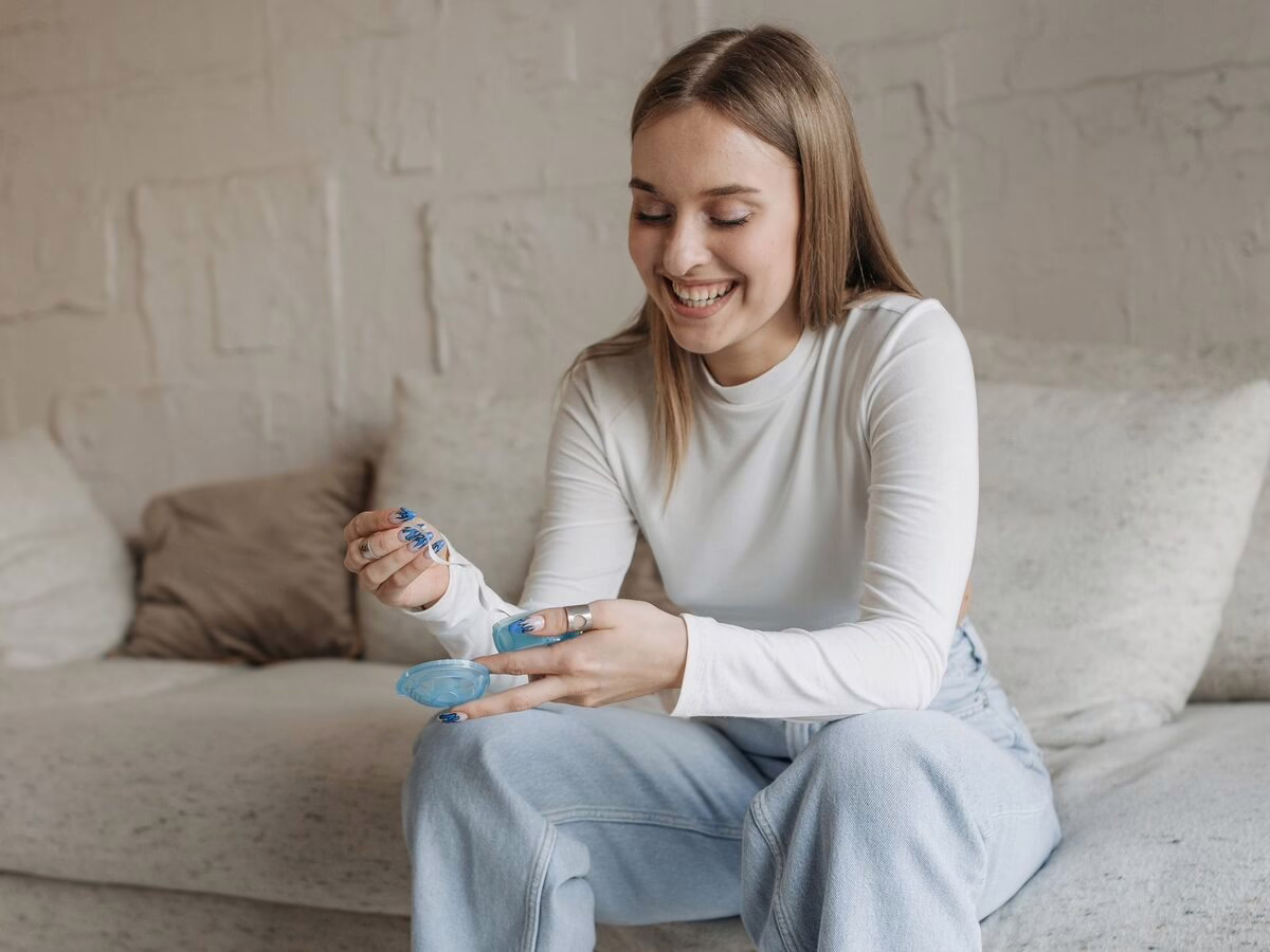 A woman at home with her aligner case