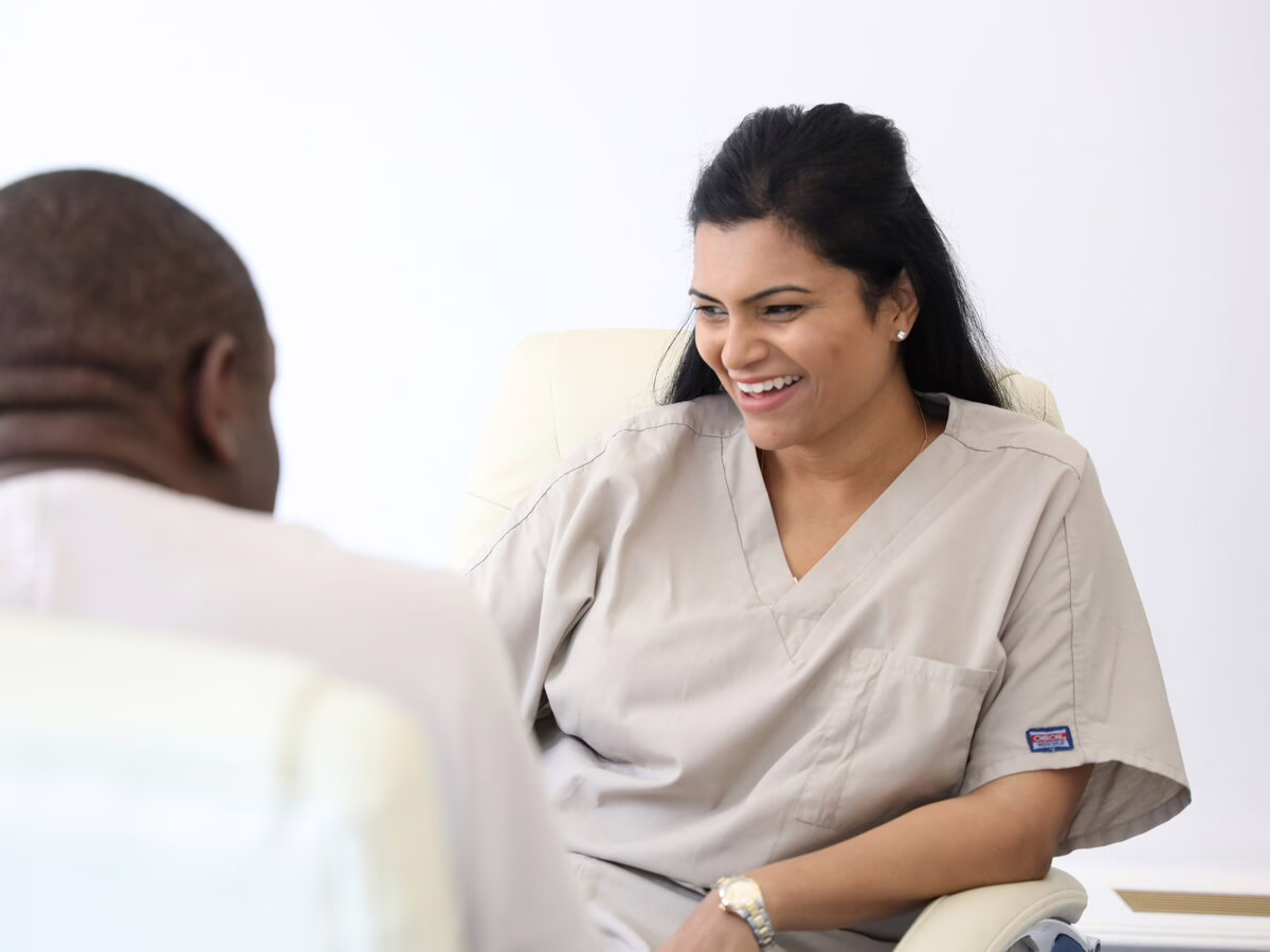 Dr Neha Patel, specialist endodontist, in discussion with Dr Ope Sodeinde