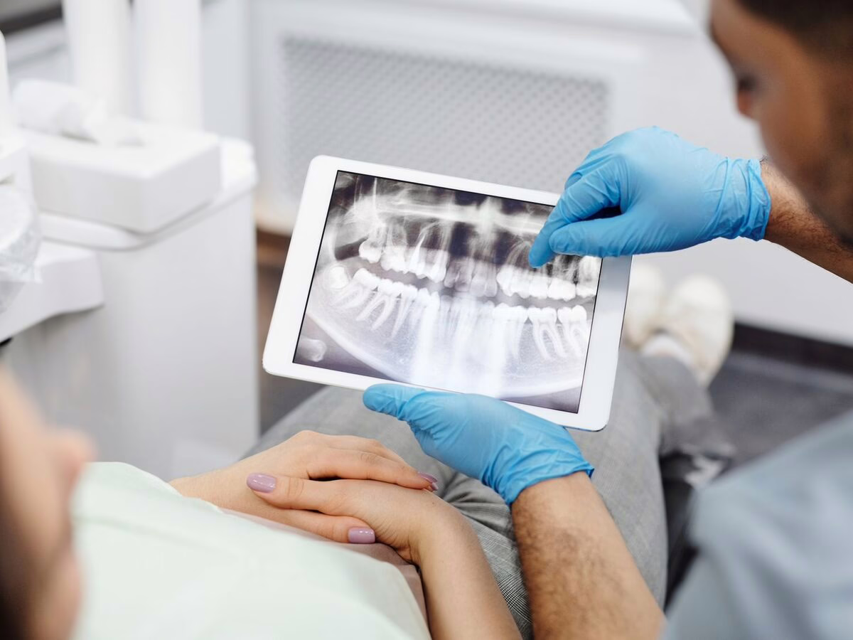 An x-ray on a tablet shown to a patient